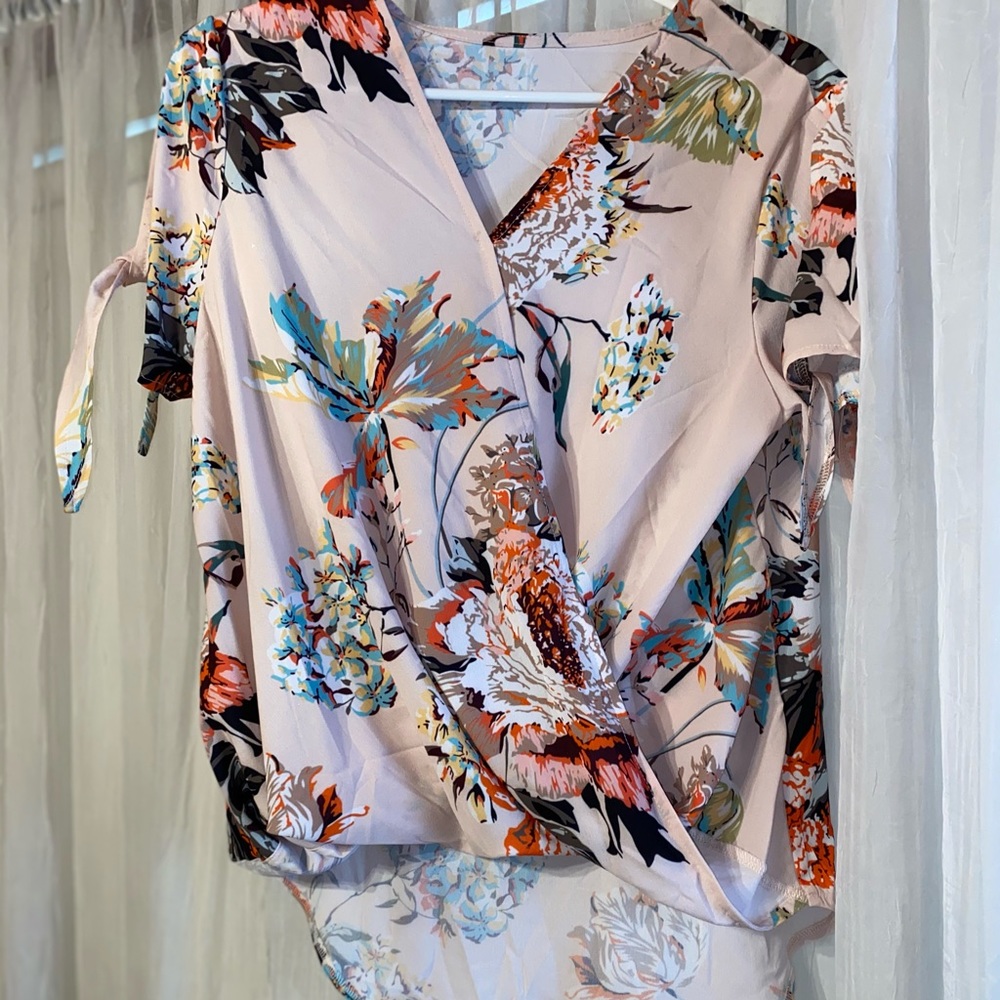 High low, cold shoulder, floral blouse.